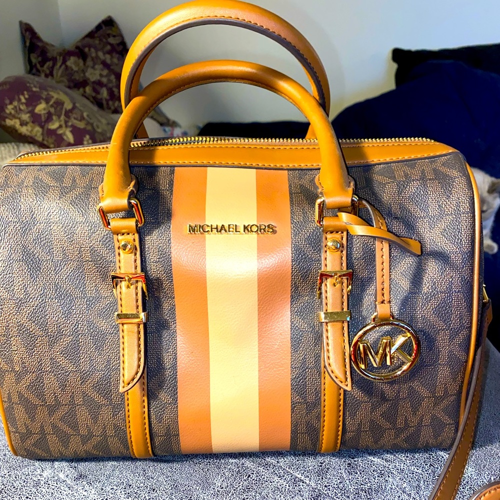 Michael Kors Medium Size barrel handbag/crossbody with strap